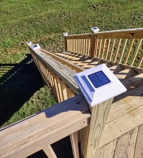 Deck railing, stair run, and post-cap detail